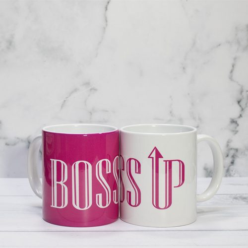 Mugs that read Boss Up in pink and white.